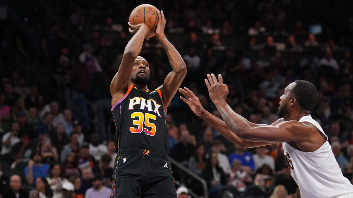 Phoenix Suns forward Kevin Durant (35) shoots against Cleveland Cavaliers forward Evan Mobley (4) during the second half at Footprint Center.