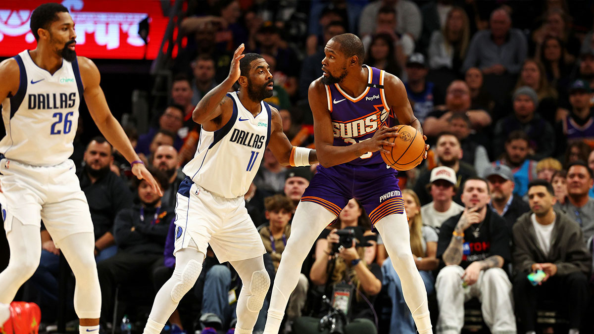 Phoenix Suns forward, Kevin Durant (35) handles the ball against Dallas Mavericks Guard Kirie Irving (11) during the third quarter at the footprint center.