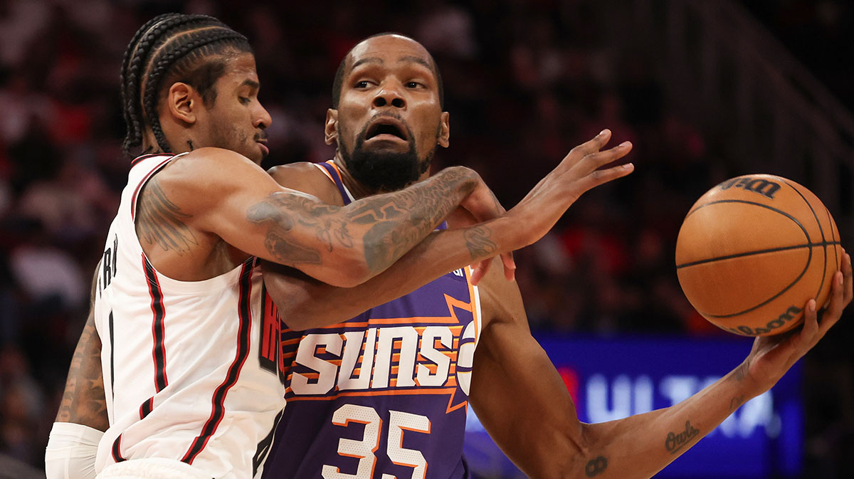 Phoenix Suns forward Kevin Durant (35) drives to the net against Houston Rockets guard Jalen Green (4) in the first quarter at Toyota Center.