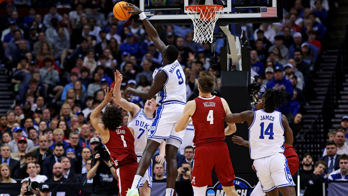 Duke Blue Devils center Khaman Maluach (9) blocks the shot of Alabama Crimson Tide guard Mark Sears (1) during the first half in the East Regional final of the 2025 NCAA tournament at Prudential Center.