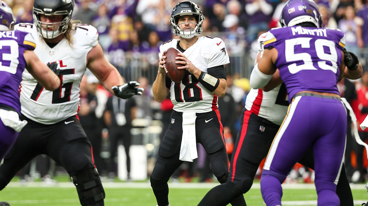 Dec 8, 2024; Minneapolis, Minnesota, USA; Atlanta Falcons quarterback Kirk Cousins (18) looks to throw against the Minnesota Vikings during the first quarter at U.S. Bank Stadium. 