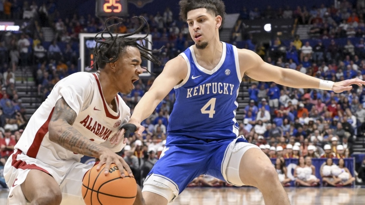 Alabama Crimson Tide forward Grant Nelson (4) dribbles the ball as Kentucky Wildcats guard Koby Brea (4) defends during the first half at Bridgestone Arena.