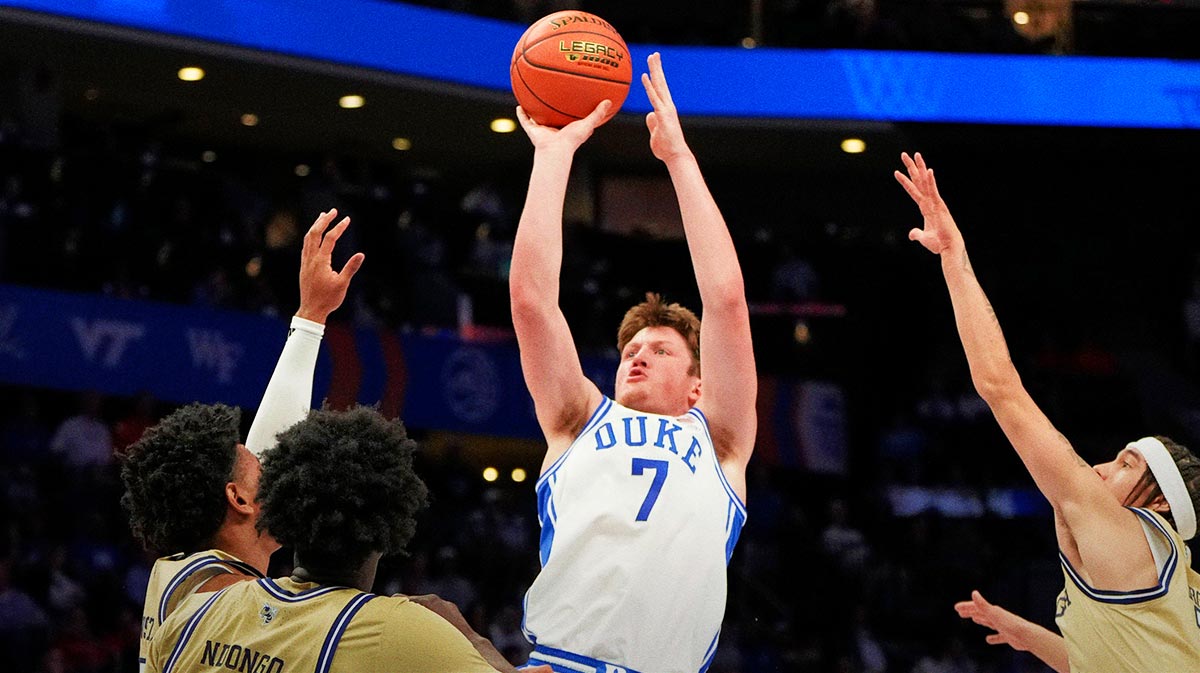 Duke Blue Devils Guard Kon Knueppel (7) shoots like Georgia Tech Yellow Jackets Forward Baye Ndongo (11) Defend in the first half in Spectrum Center. 