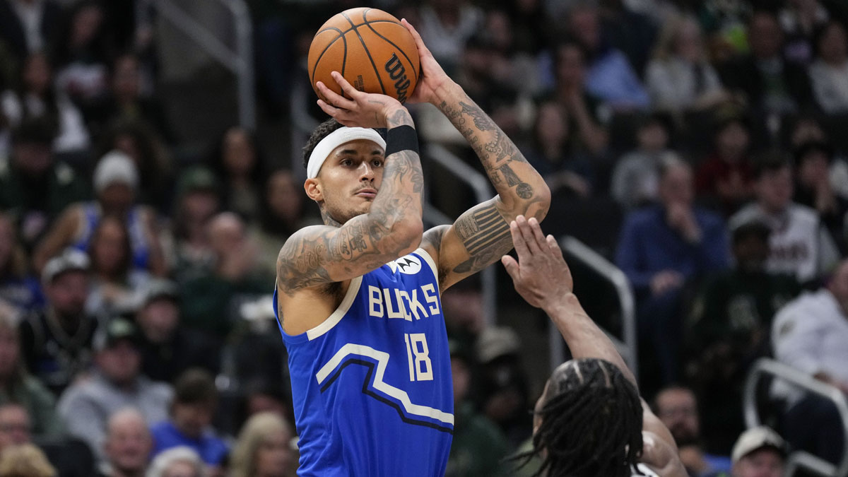 Milwaukee Bucks forward Kyle Kuzma (18) shoots over Indiana Pacers forward Aaron Nesmith (23) during the third quarter at Fiserv Forum.