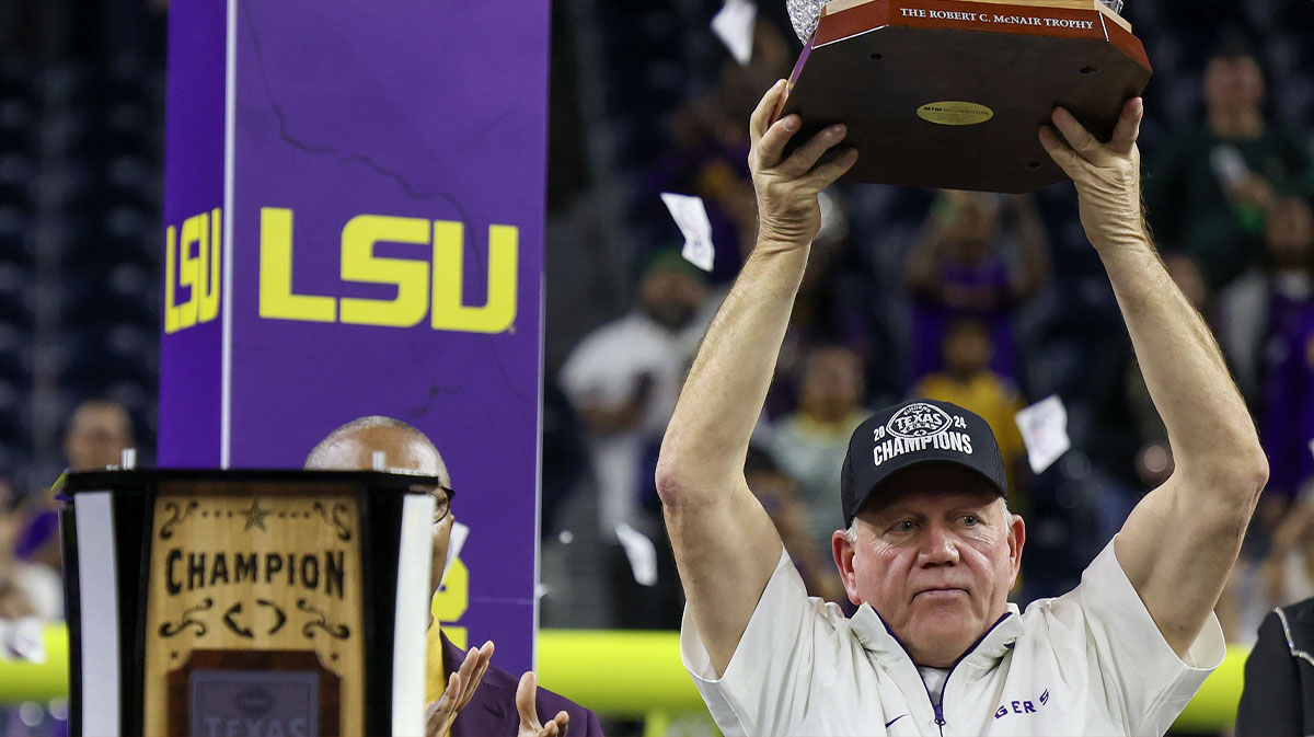 LSU Tigers head coach Brian Kelly holds up the trophy after defeating the Baylor Bears in the Kinder’s Texas Bowl in the second half at NRG Stadium.