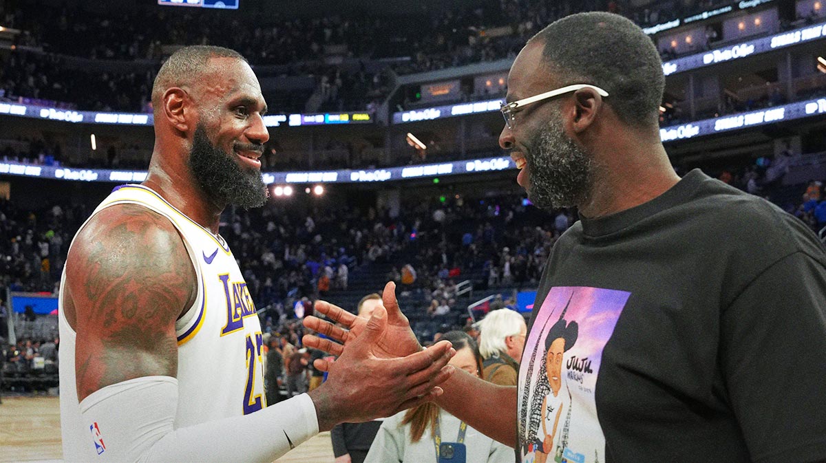 Lakers forward LeBron James (left) talks with Golden State Warriors forward Draymond Green (right) after the game at Chase Center