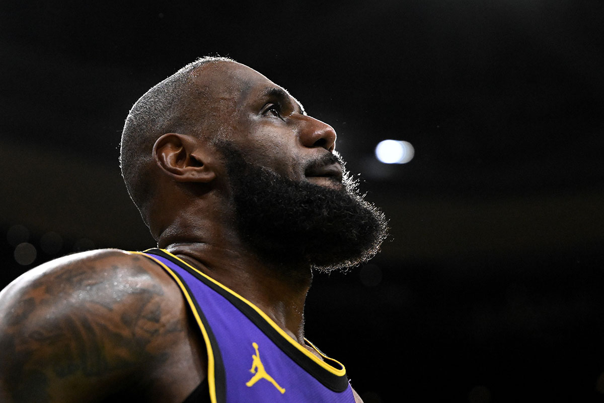 Lakers forward LeBron James (23) looks into the crowd during a timeout in the fourth quarter of a game against the Boston Celtics at the TD Garden