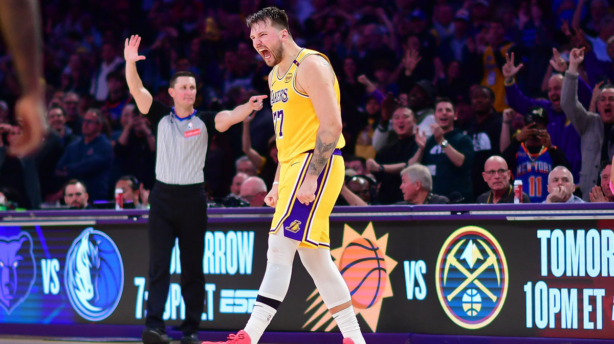 Los Angeles Lakers guard Luka Doncic (77) reacts after scoring a basket against the New York Knicks during overtime at Crypto.com Arena.