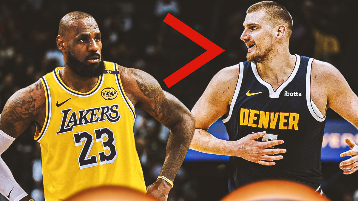 LeBron James standing next to Nikola Jokic. There is a greater than sign pointing toward James with Jokic standing next to him. (EX: James will be on the left, next to James is this sign > and Jokic is next to the sign)