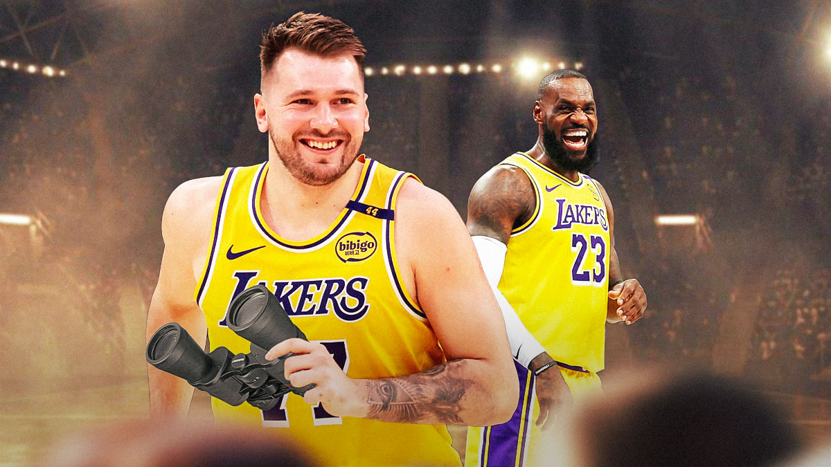 Lakers' Luka Doncic holding binoculars, with LeBron James smiling beside him