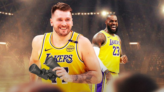 Lakers' Luka Doncic holding binoculars, with LeBron James smiling beside him