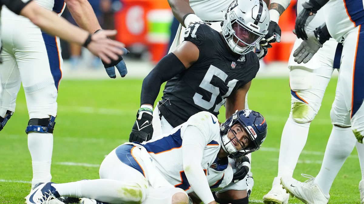 Denver Broncos quarterback Jarrett Stidham (4) reacts after being knocked down by Las Vegas Raiders defensive end Malcolm Koonce (51) during the second quarter at Allegiant Stadium.