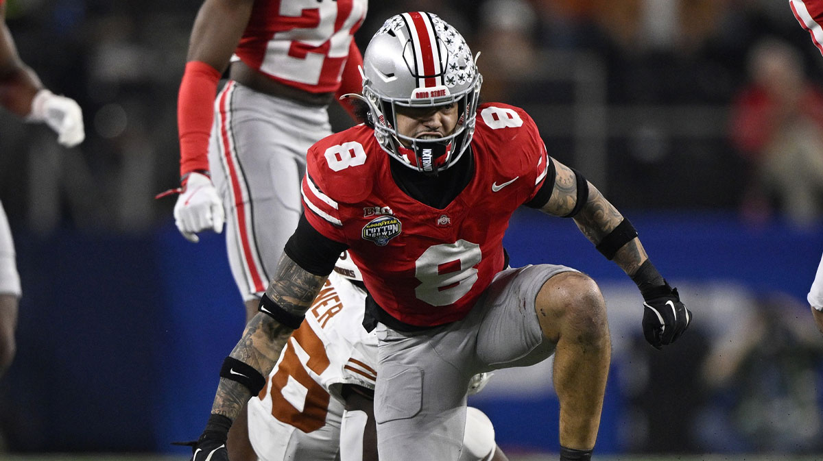 Ohio State Buckeyes safety Lathan Ransom (8) tackles Texas Longhorns running back Quintrevion Wisner (26) during the third quarter of the College Football Playoff semifinal in the Cotton Bowl at AT&T Stadium. 