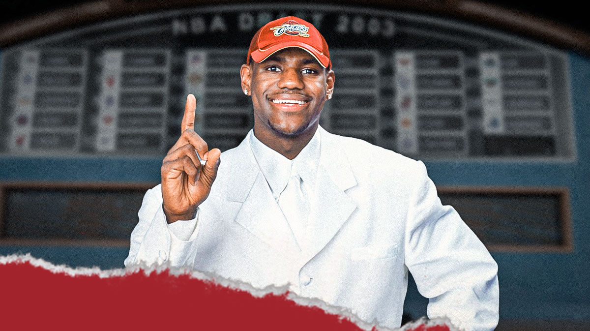 LeBron James in his 2003 white draft suit, with the 2003 NBA Draft board next to him.