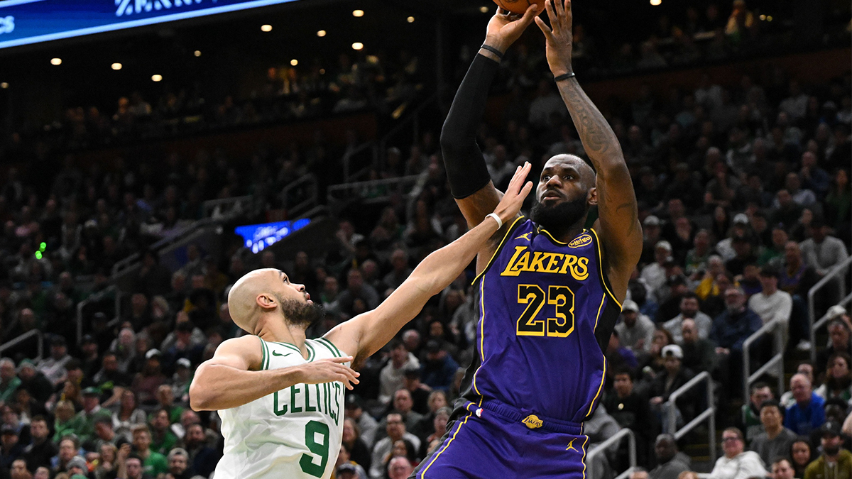 Los Angeles Lebron James (23) Tries to shoot Boston Celtics Guard Derrick White (9) during the fourth quarter on the TD garden. 