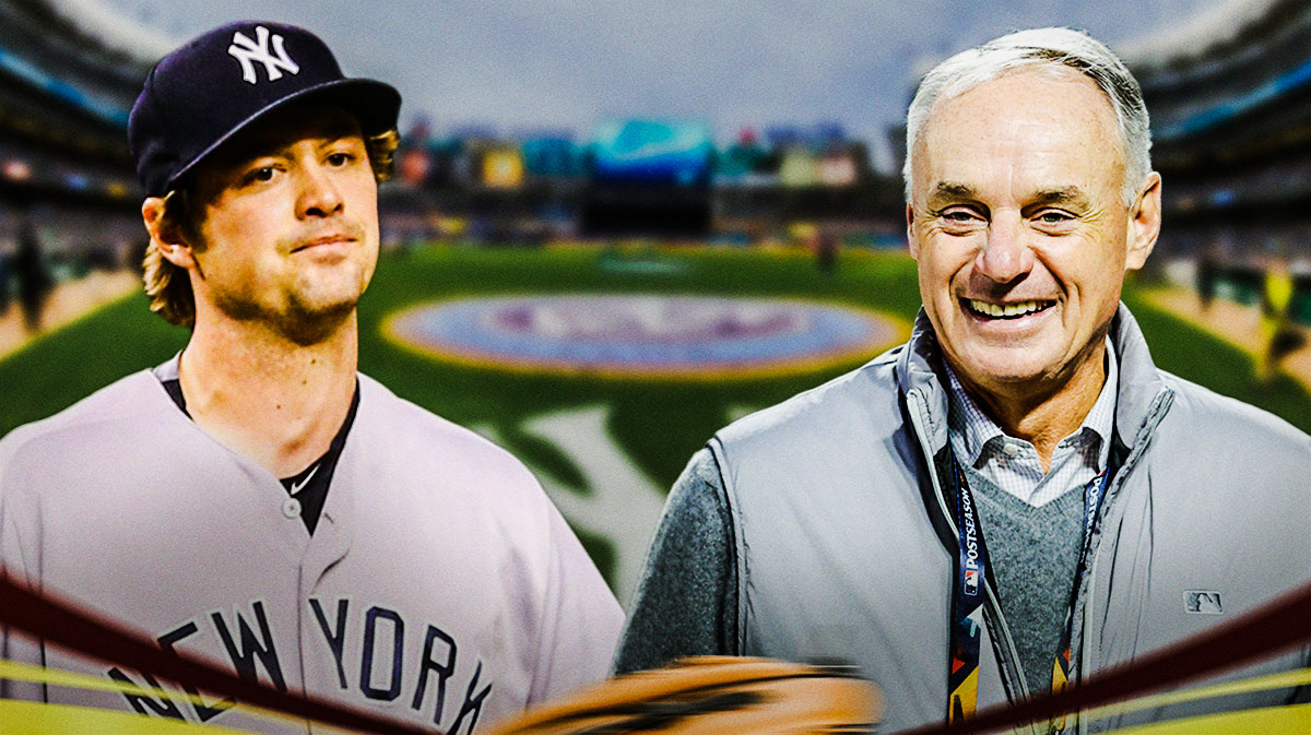 Andrew Miller with Yankees on right. Rob Manfred on left