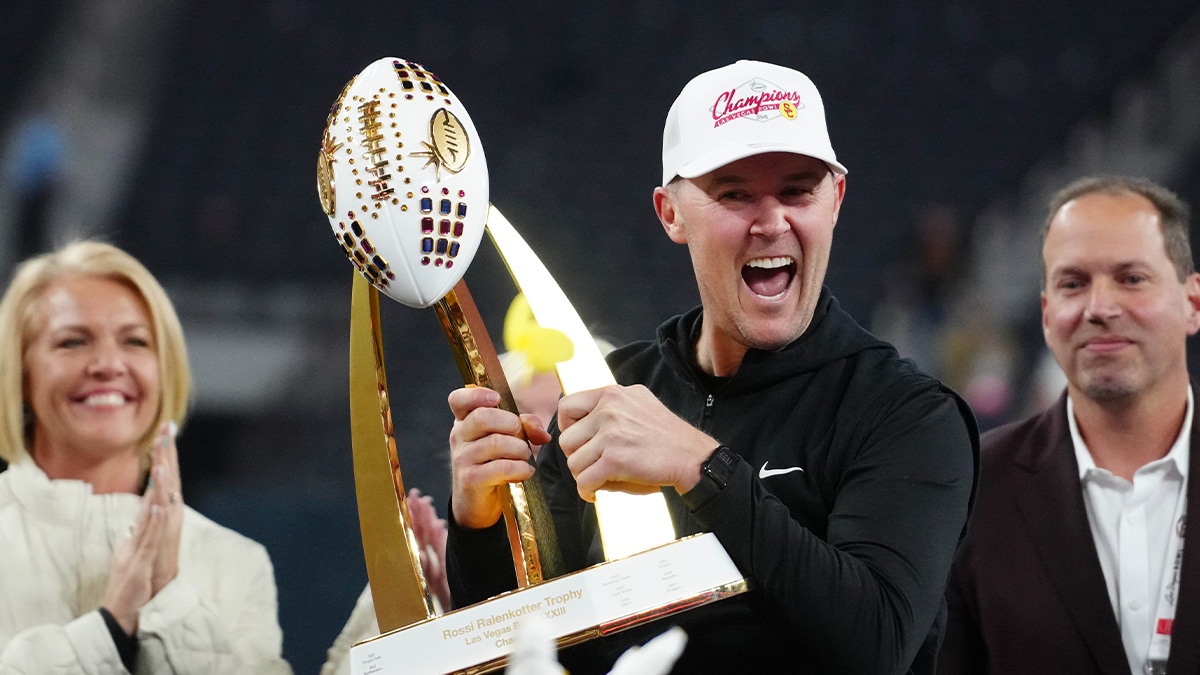 Southern California Trojans head coach Lincoln Riley holds the championship trophy after the game against the Texas A&M Aggies at Allegiant Stadium. Mandatory Credit: Kirby Lee-Imagn Images