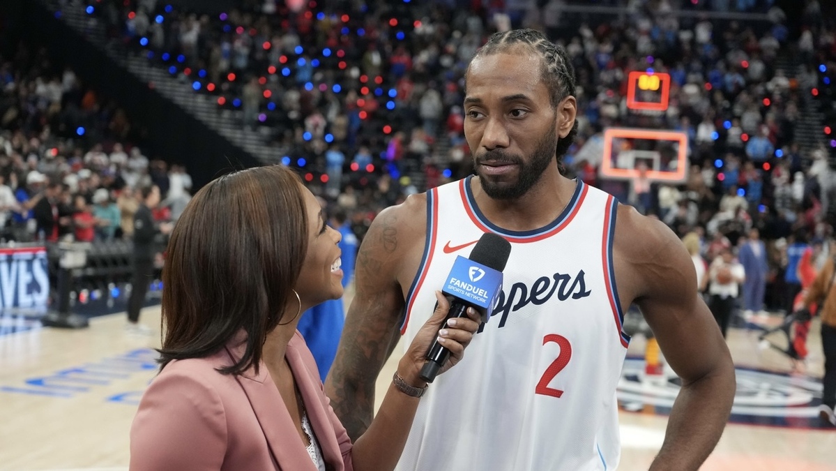 FanDuel reporter Kristina Pink (left) interviews LA Clippers forward Kawhi Leonard (2) after the game against the Sacramento Kings at the Intuit Dome.