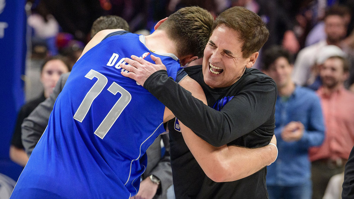 Dallas Mavericks Owner Mark Cuban hugs forwards Luke Doncic (77) After winning San Antonio Spurs in the American Airline.