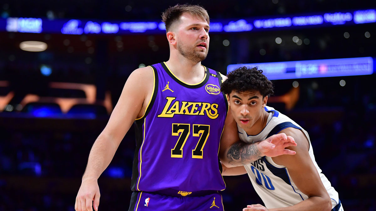 Los Angeles Lakers guard Luka Doncic (77) attempts to gain position on Dallas Mavericks guard Max Christie (00) during the second half at Crypto.com Arena.
