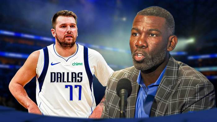 Mavericks Luka Doncic on left, Mavericks Michael Finley on right. Both looking serious.