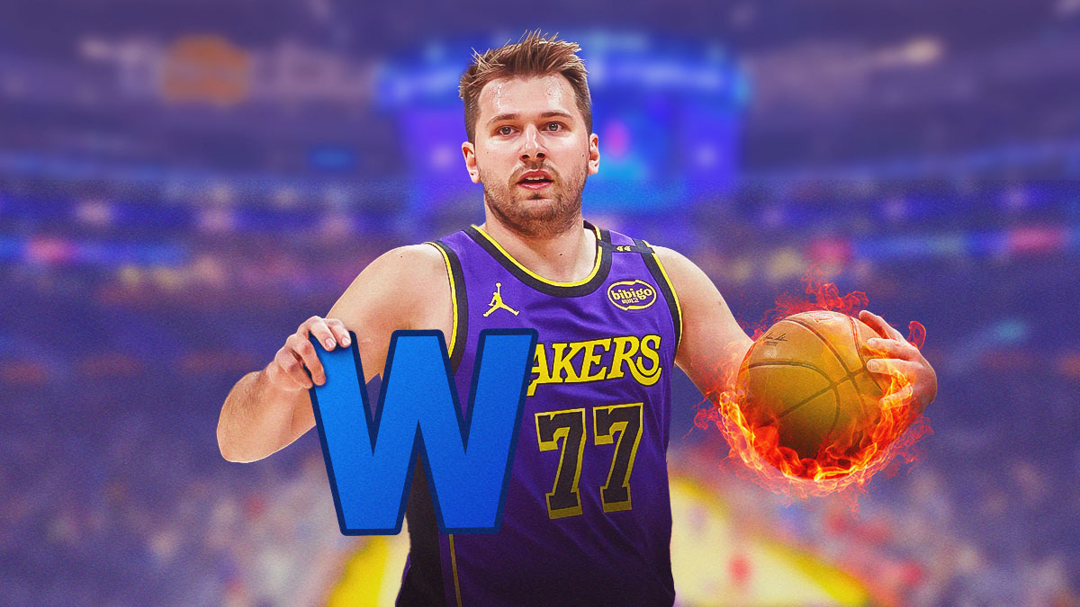Lakers' Luka Doncic holding a 'W' on one hand and a flaming ball on another