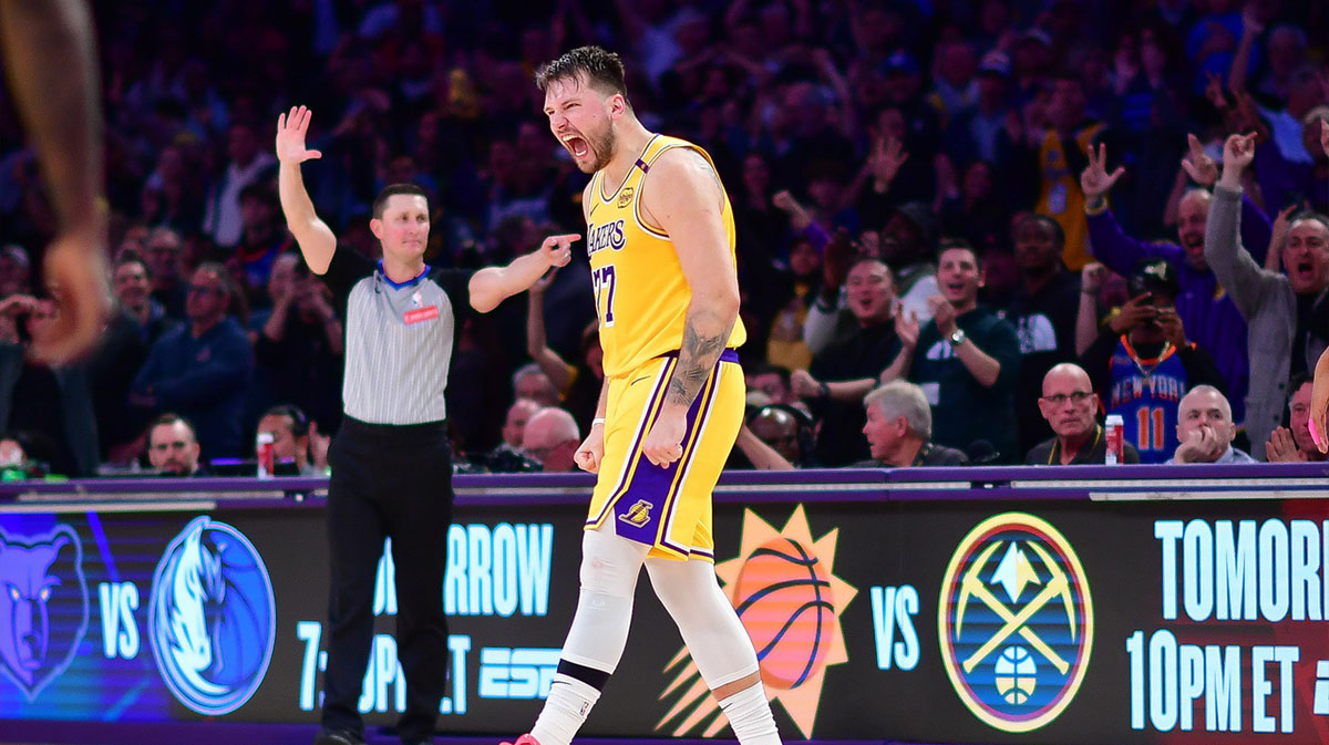 Los Angeles Lakers guard Luka Doncic (77) reacts after scoring a basket against the New York Knicks during overtime at Crypto.com Arena.