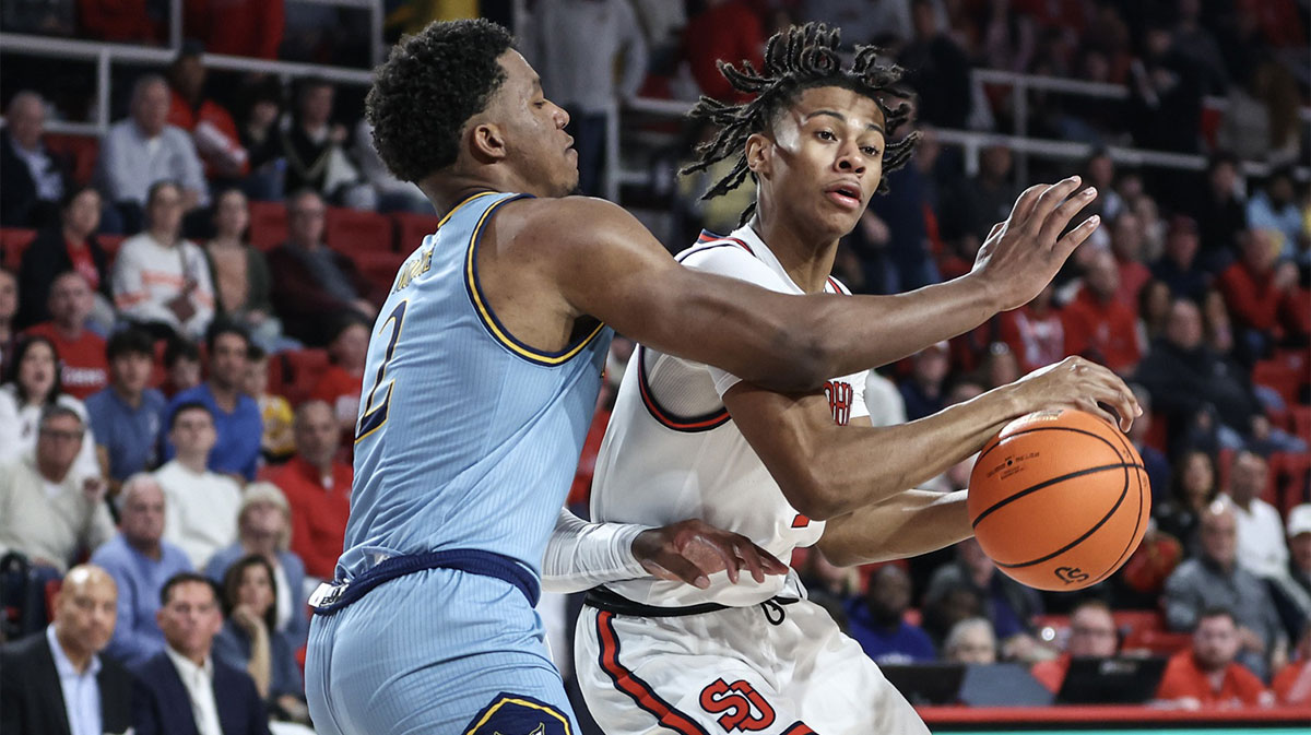 St. John's Red Storm guard Simeon Wilcher (7) looks to drive past Quinnipiac Bobcats forward Amarri Monroe (2) in the second half at Carnesecca Arena.