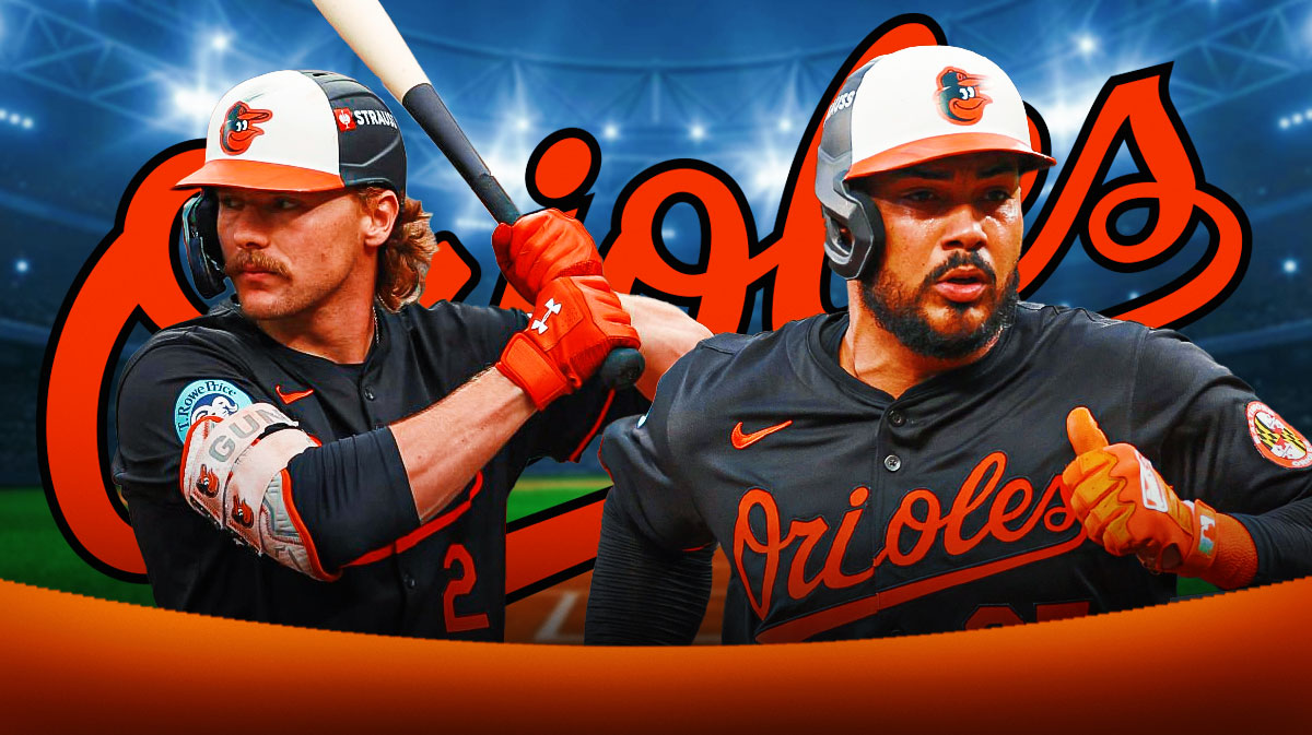 Baltimore Orioles players Anthony Santander and Gunnar Henderson looking hyped with the Orioles logo in the background