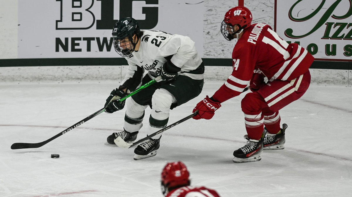 MSU's Shane Vansaghi moves the puck against Wisconsin.