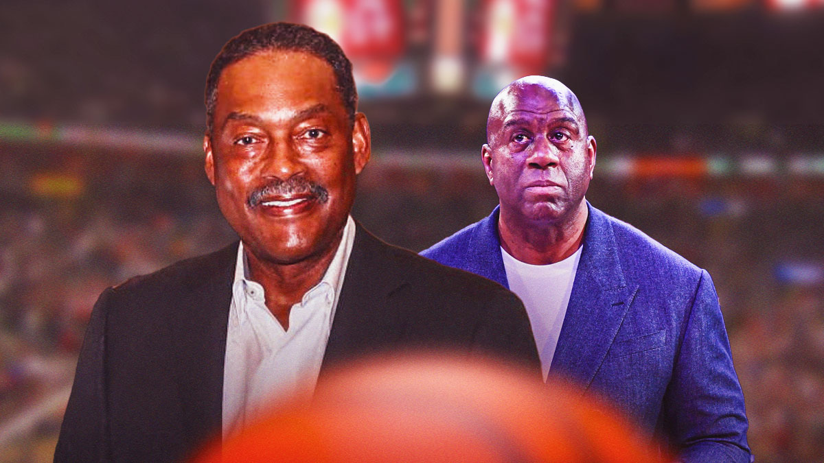 Magic Johnson next to Junior Bridgeman