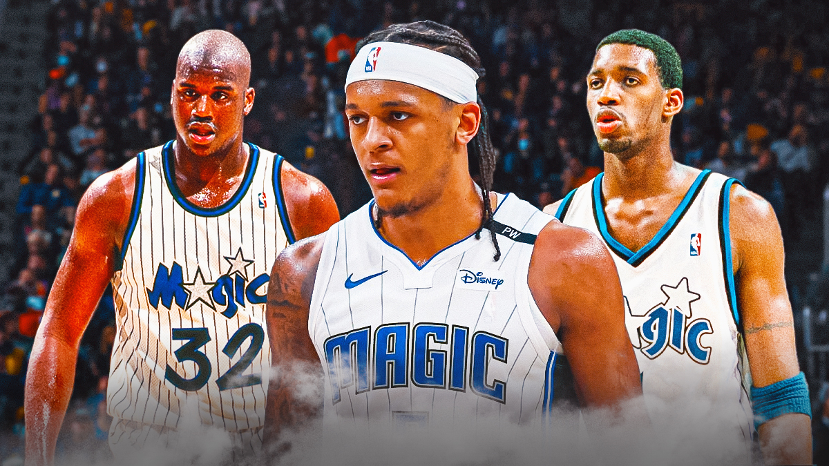 Magic forward Paulo Banchero (in front). Behind him, former Orlando Magic center Shaquille O'Neal (left) and former Orlando Magic player, Tracy McGrady(right).