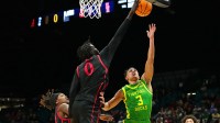 San Diego State Aztecs forward Magoon Gwath (0) blocks a shot attempt by Oregon Ducks guard Jackson Shelstad (3) during the first half at MGM Grand Garden Arena.