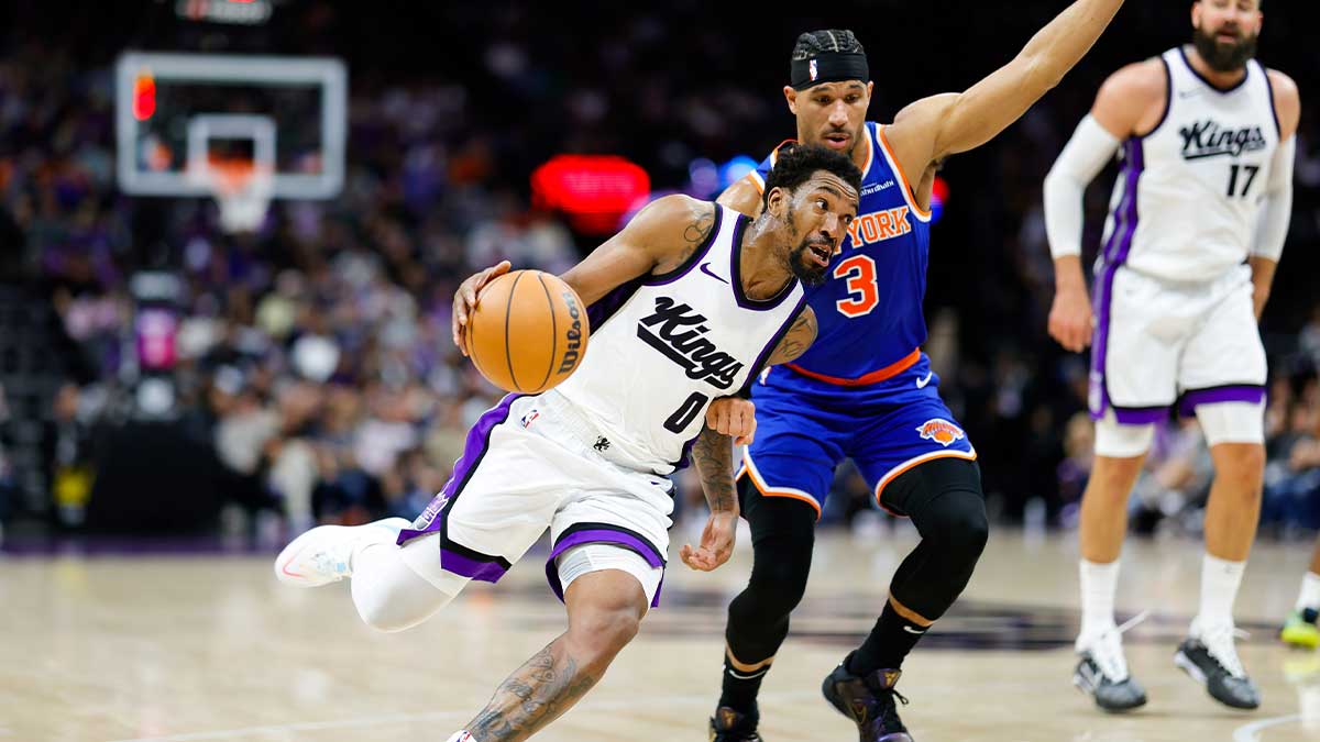 Sacramento Kings Guard Malik Monk (0) Dribblible Ball against New York Knicks Guard Josh Hart (3) During the third quarter of Golden 1.