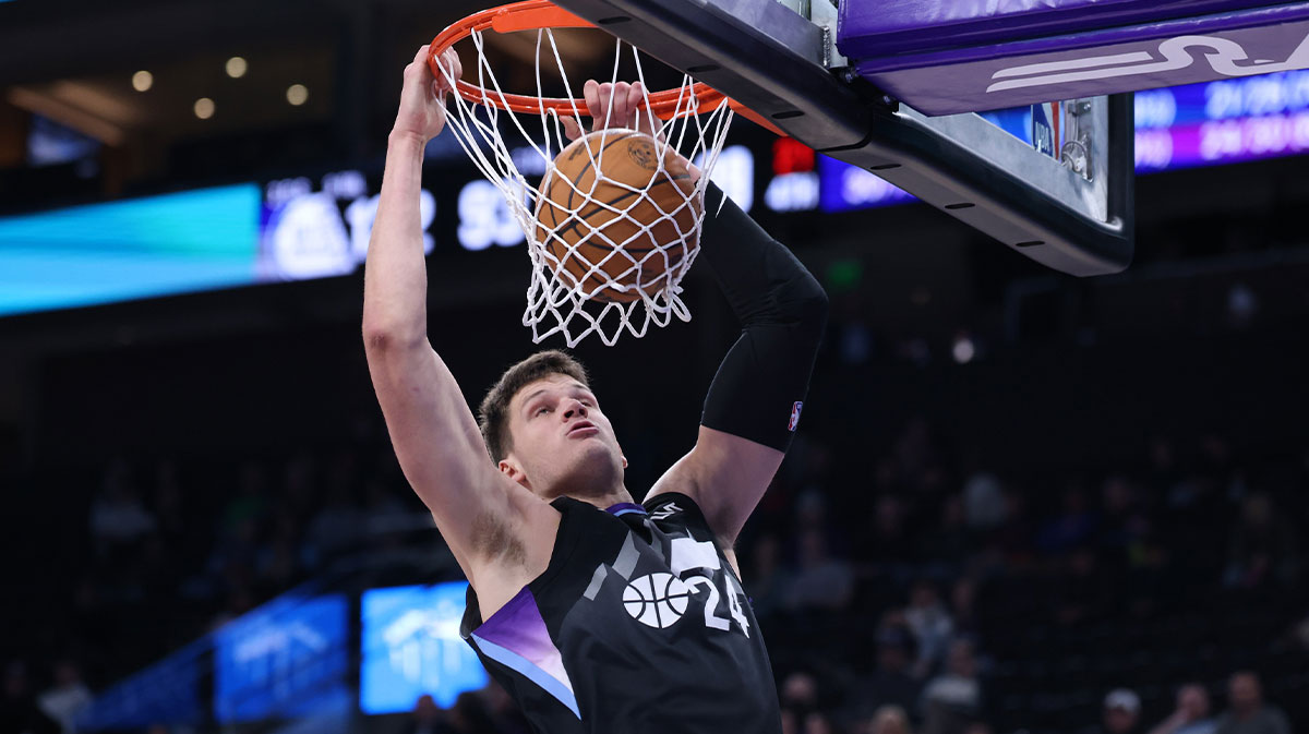 Utah Jazz center Walker Kessler (24) dunks against the Detroit Pistons during the second half at Delta Center.