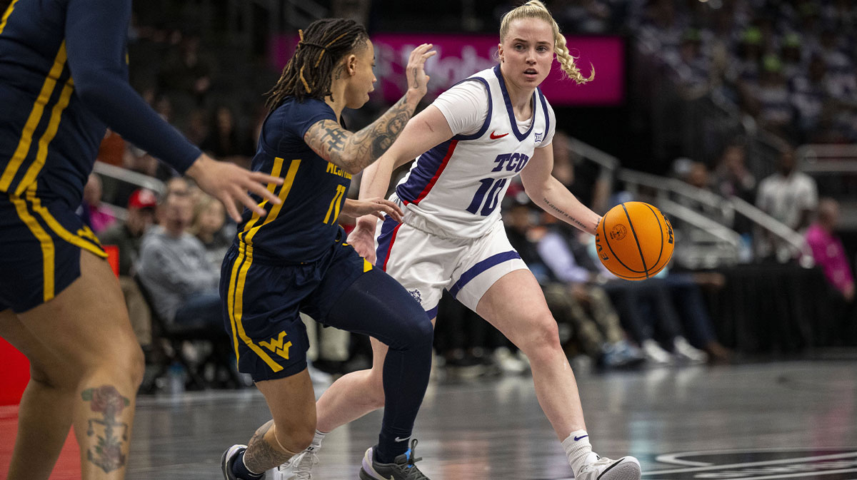 TCU Horned Frogs guard Hailey Van Lith (10) handles the ball while while defended by West Virginia Mountaineers guard JJ Quinerly (11) during the first half at T-Mobile Center.