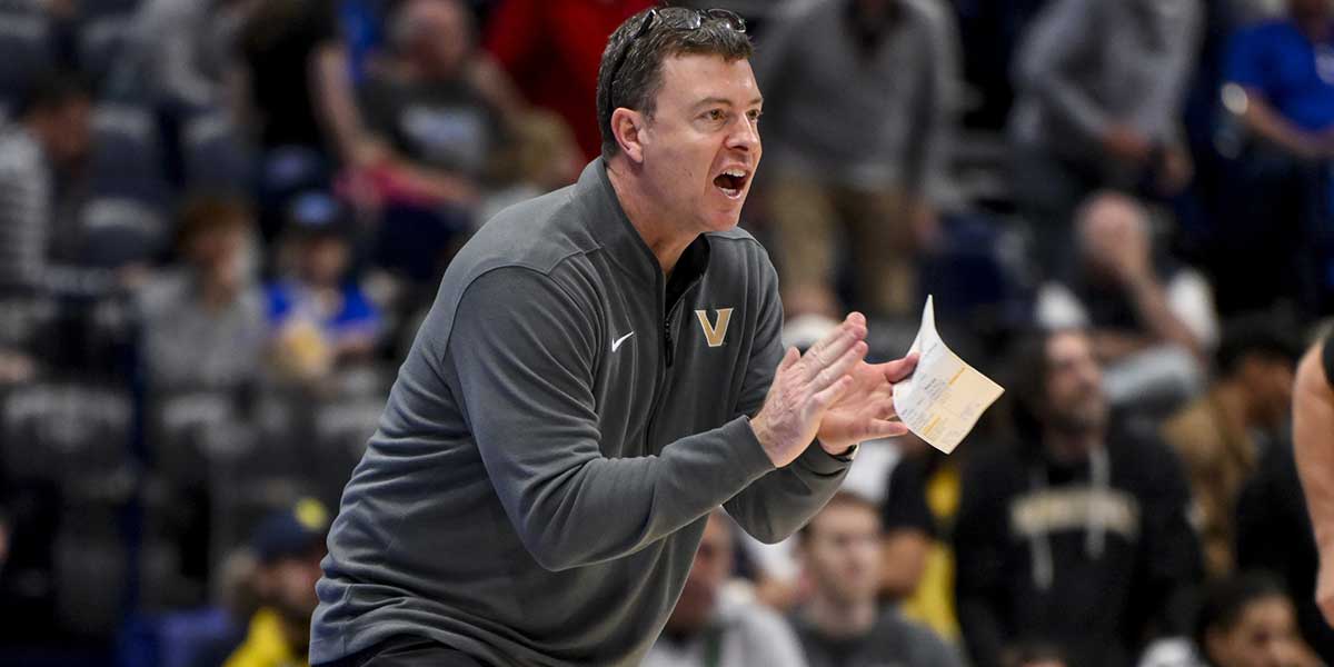 Vanderbilt Commodores head coach Mark Byington cheers on his team against the Texas Longhorns during the second half at Bridgestone Arena.