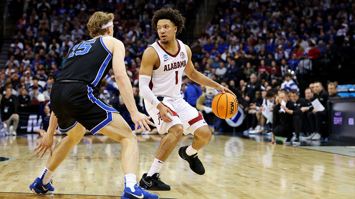 Mar 27, 2025; Newark, NJ, USA; Alabama Crimson Tide guard Mark Sears (1) handles the ball against Brigham Young Cougars forward Richie Saunders (15) during the second half during an East Regional semifinal of the 2025 NCAA tournament at Prudential Center.