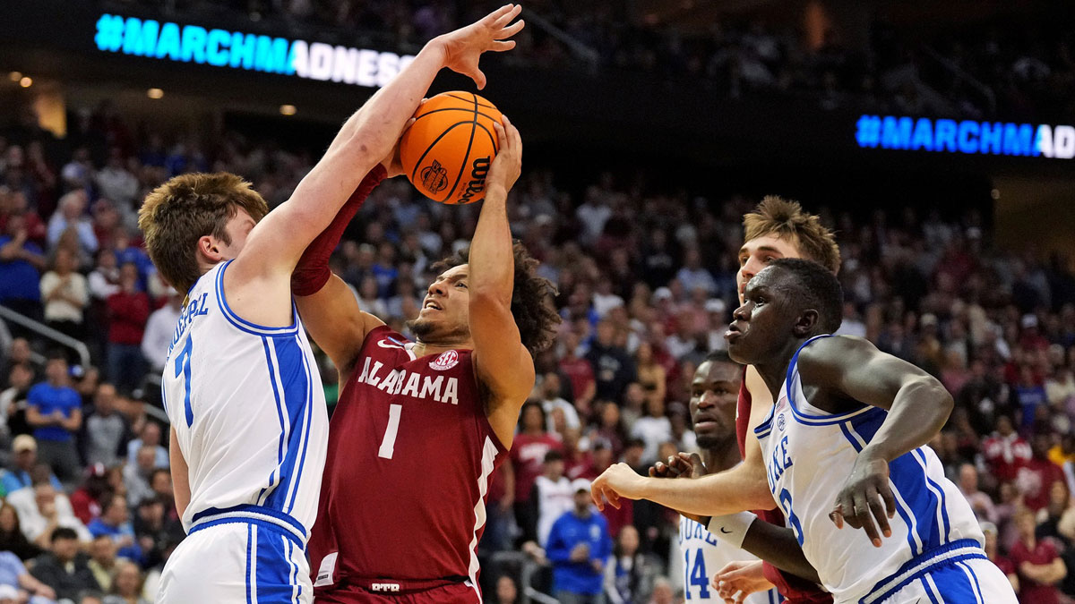 Alabama Crimson Tide guard Mark Sears (1) drives to the basket against Duke Blue Devils guard Kon Knueppel (7) during the first half in the East Regional final of the 2025 NCAA tournament at Prudential Center.