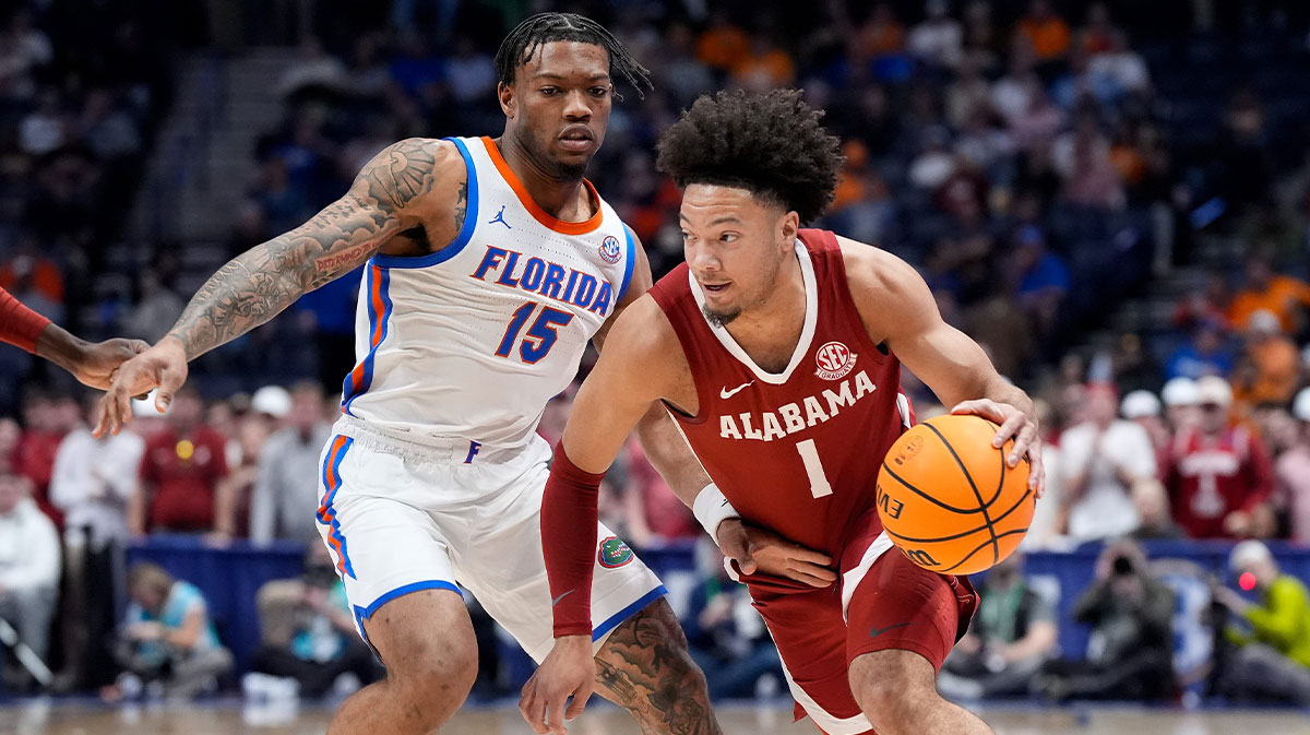 Alabama guard Mark Sears (1) works past Florida guard Alijah Martin (15) during the first half of a Southeastern Conference tournament semifinal game at Bridgestone Arena in Nashville, Tenn., Saturday, March 15, 2025. 