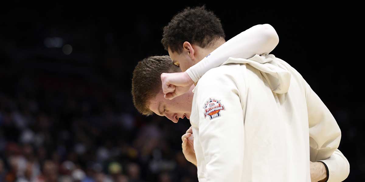 American University Eagles forward Matt Rogers (15) leaves the court after an apparent injury in the first half against the Mount St. Mary's Mountaineers at UD Arena. Mandatory Credit: Rick Osentoski-Imagn Images