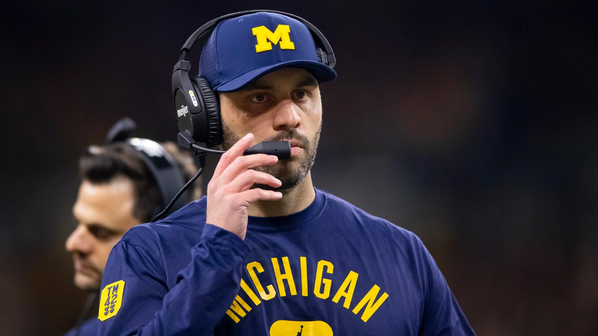 Ex-Michigan coach charged in 24-count indictment