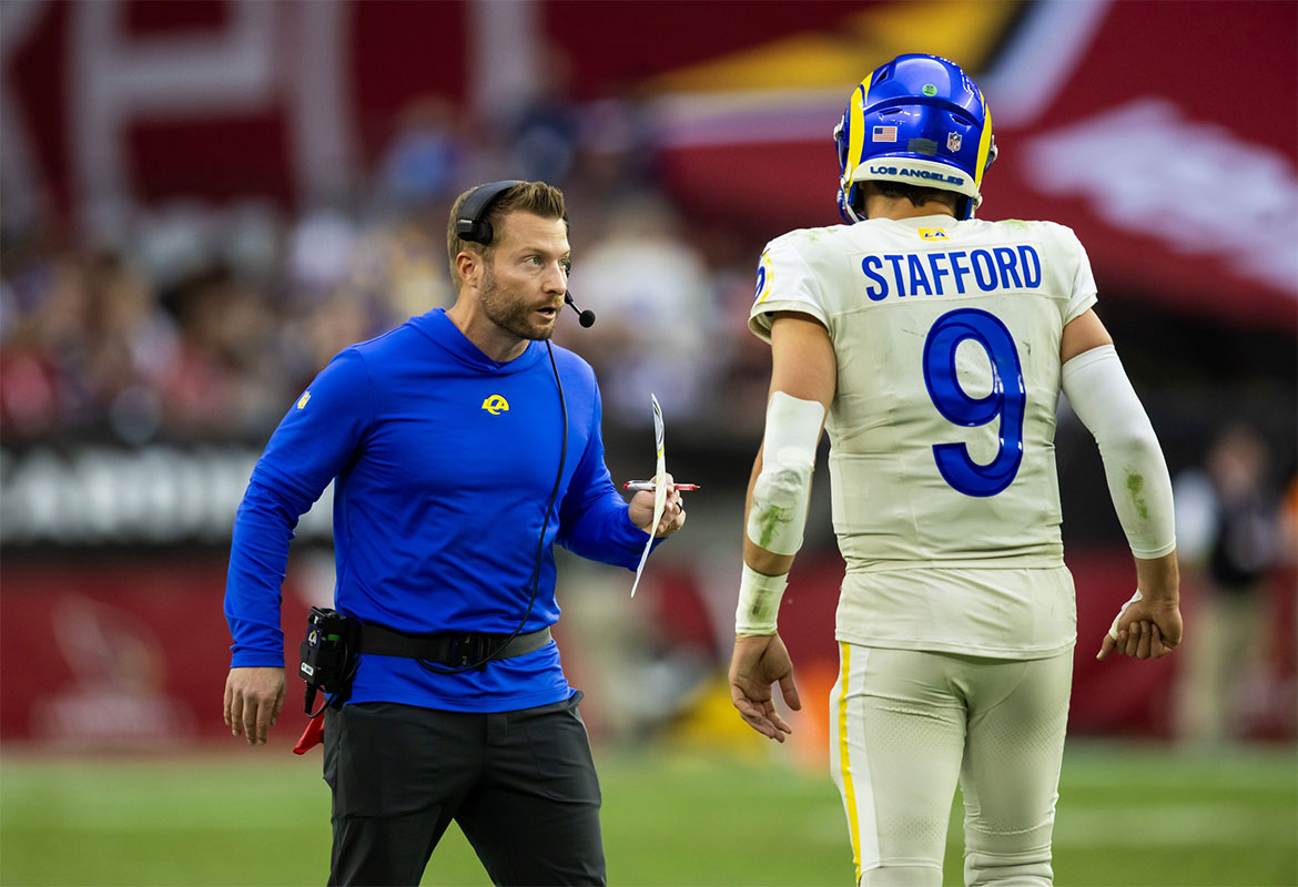 Los Angeles Rams head coach Sean McVay talks with quarterback Matthew Stafford (9) against the Arizona Cardinals at State Farm Stadium.