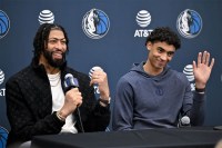 Dallas Mavericks forward Anthony Davis (left) and guard Max Christie (right) speak to the media during a press conference at the Dallas Mavericks practice facility.