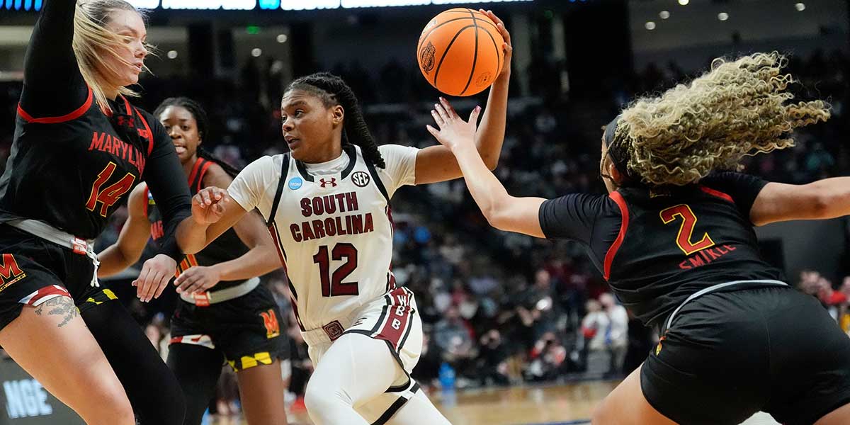 Maryland Terrapins forward Allie Kubek (14) and Maryland Terrapins guard Kaylene Smikle (2) defend South Carolina Gamecocks guard MiLaysia Fulwiley (12) at Legacy Arena in the Sweet 16. South Carolina advanced to the Elite 8 wtih a 71-67 victory.
