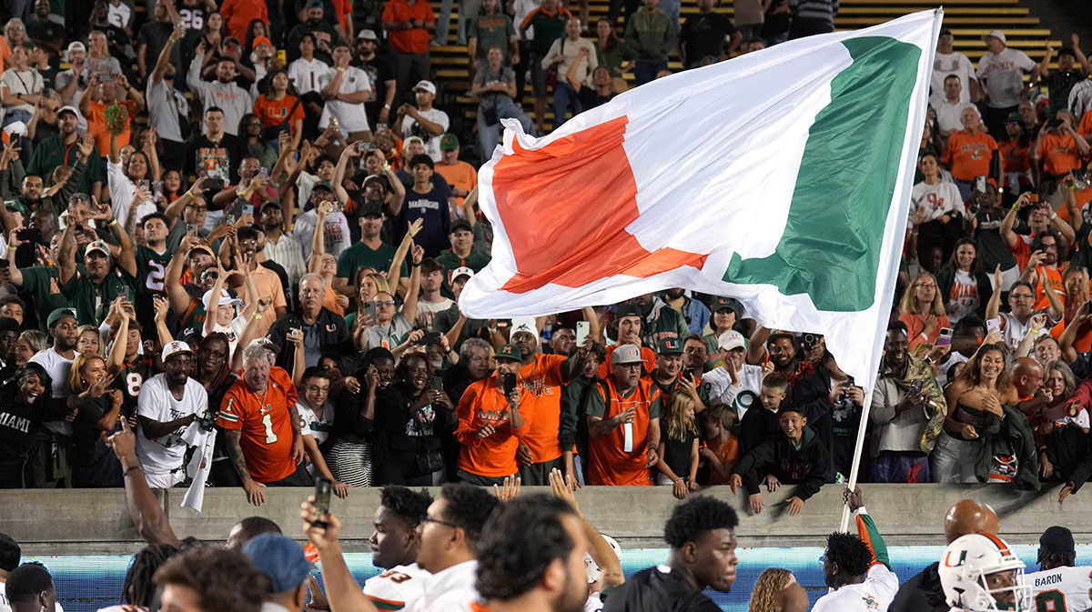 Miami Hurricanes fans cheer with players after defeating the California Golden Bears at California Memorial Stadium. Mandatory Credit: Darren Yamashita-Imagn Images