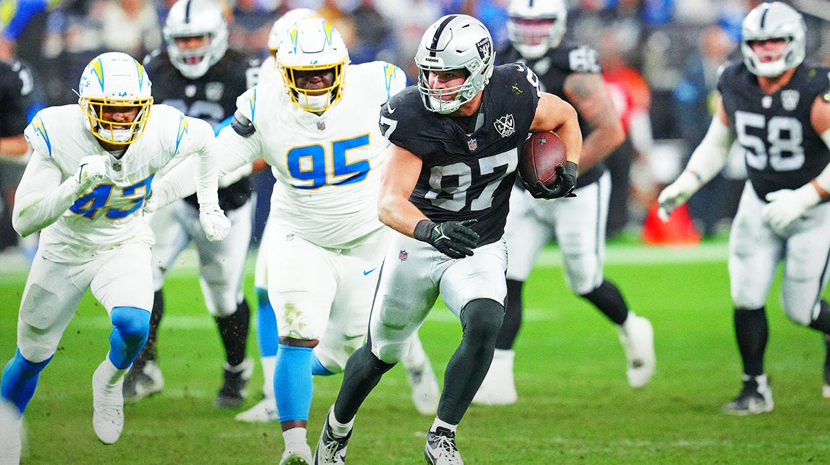 Jan 5, 2025; Paradise, Nevada, USA; Las Vegas Raiders tight end Michael Mayer (87) gains yardage against the Los Angeles Chargers during the fourth quarter at Allegiant Stadium.