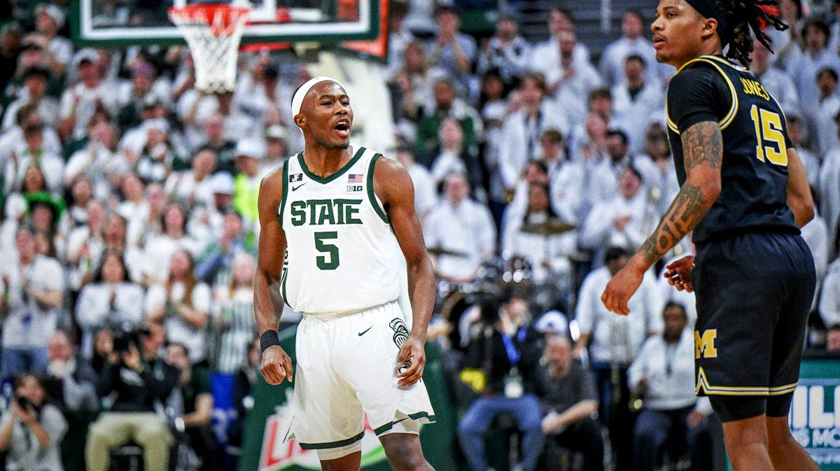 Michigan State's Tre Holloman, left, jaws at Michigan's Rubin Jones after scoring during the second half on Sunday, March 9, 2025, at the Breslin Center in East Lansing.