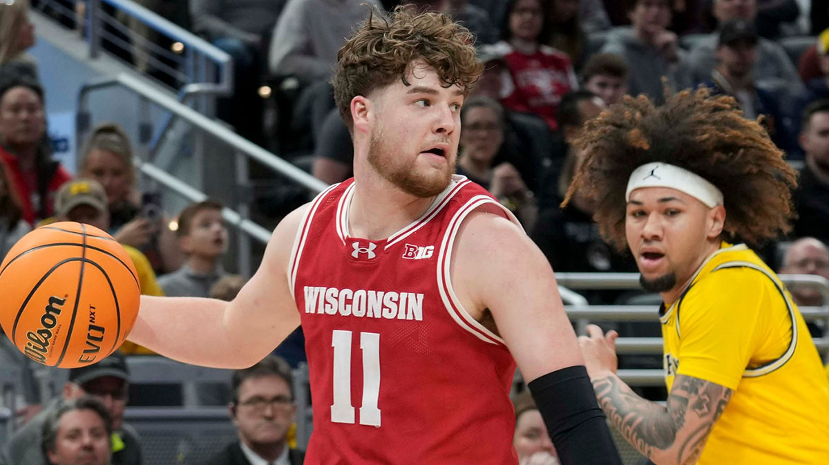 Michigan Wolverines guard Tre Donaldson (3) guards Wisconsin Badgers guard Max Klesmit (11) during the first half of the 2025 TIAA Big Ten Men’s Basketball Tournament final game on Sunday, March 16, 2025, at Gainbridge Fieldhouse in Indianapolis. Michigan defeated Wisconsin 59-53.