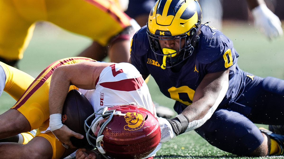 Michigan defensive end Josaiah Stewart (0) sacks USC quarterback Miller Moss (7) during the first half at Michigan Stadium in Ann Arbor on Saturday, Sept. 21, 2024. 